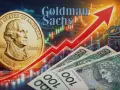 Złoty i dolar na tle wykresu giełdowego. Goldman Sachs analizuje, co z dolarem i polską walutą.